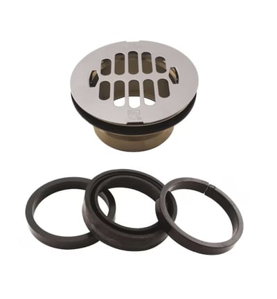 Chrome grid shower drain cover with brass body and three rubber gasket sealing rings for walk-in tub or accessible shower installation