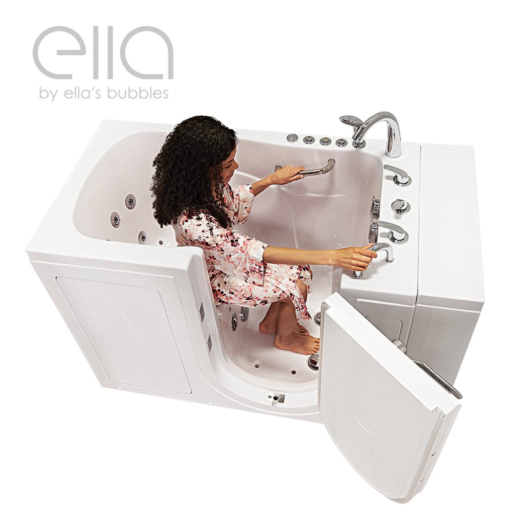 Woman in floral robe seated inside Ella Monaco walk-in tub gripping grab bars with outward swing door open