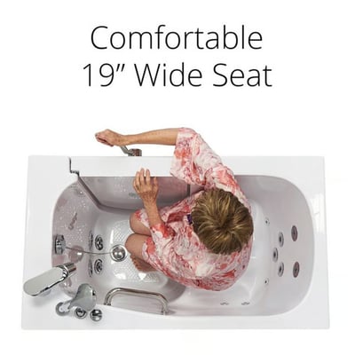 Overhead view of senior woman seated on the comfortable 19-inch wide seat inside an Ella walk-in tub with hydro jets
