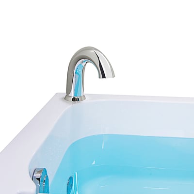 Close-up of a chrome deck-mount faucet on the Ella Homecare 32x60 transfer bathtub filled with water