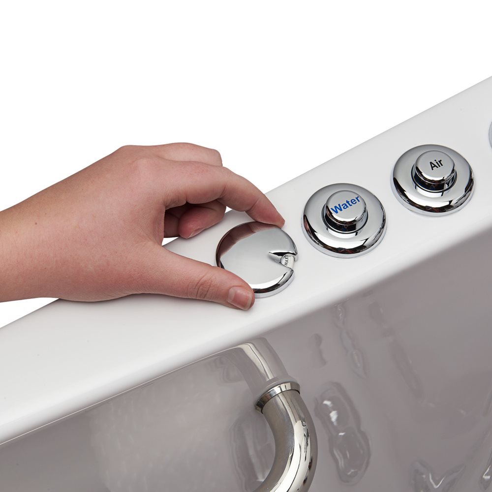 Hand turning the chrome hydro massage intensity control dial on an Ella Front Entry walk-in tub