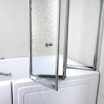 Close up of a four fold tempered glass shower screen with chrome frame and knob on the deck of a white walk in tub.