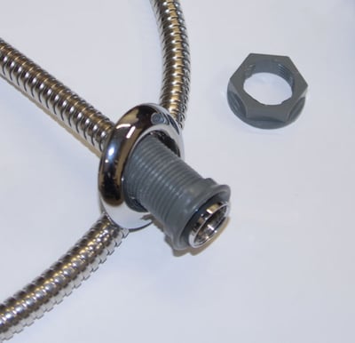 Close-up of stainless steel flexible hose deck mount kit fitting with chrome collar and hex nut for walk-in tub hand mixer