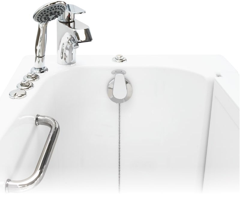 Close-up of a walk-in tub interior featuring chrome faucet, handheld showerhead, grab bar, and chain drain pull