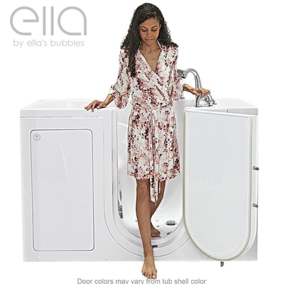 Woman in floral robe stepping into the Ella Monaco walk-in tub through the wide outward swing door with low-step entry