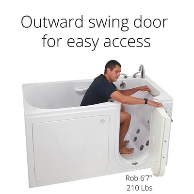 Man seated inside an Ella walk-in tub demonstrating the outward swing door opening for easy low-step access