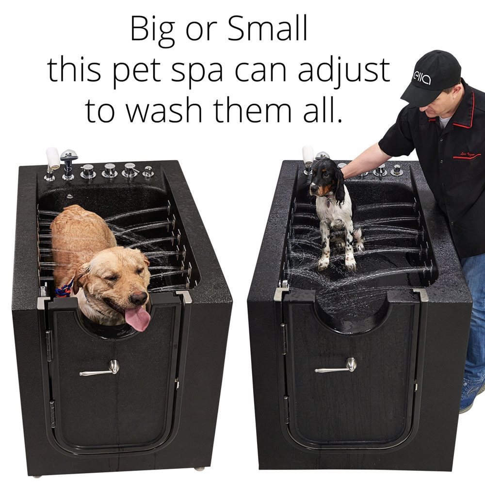 Large golden retriever and small spaniel being bathed in the Ella Microbubble Therapy Pet Spa grooming tub