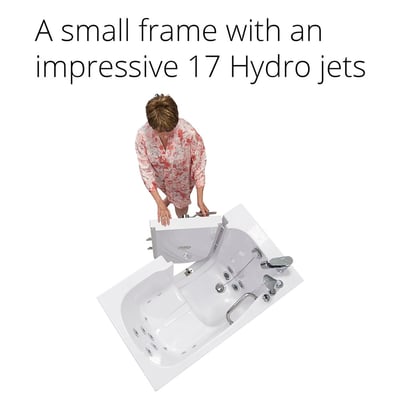 Senior woman opening the outward swing door of a compact Ella walk-in tub with 17 hydro jets - top view