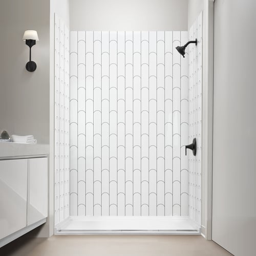Walk in shower with vertical bamboo arch pattern acrylic wall panels and a matte black rain shower head