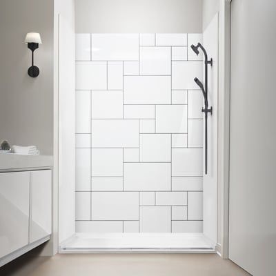 Ella Square Scape acrylic shower wall panels with white tile pattern and matte black grab bar and handheld showerhead