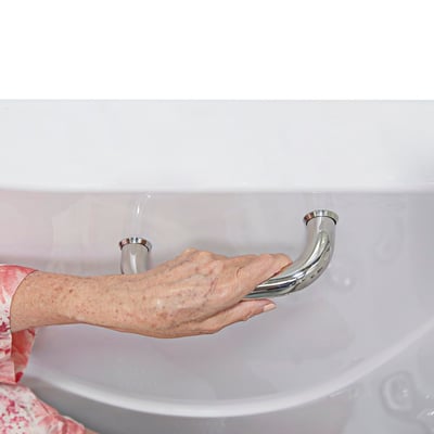 Senior woman's hand gripping a polished chrome safety grab bar on the interior wall of an Ella walk-in tub