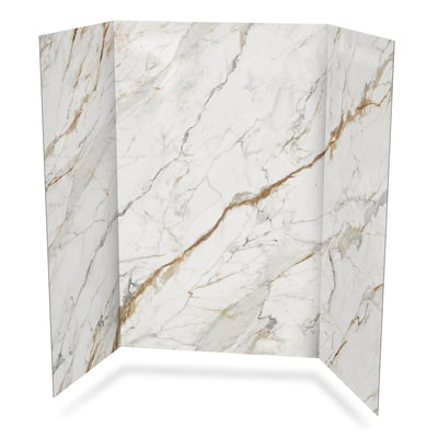 Three-panel shower wall surround in Calacatta Luxor marble pattern with gold and gray veining on white background