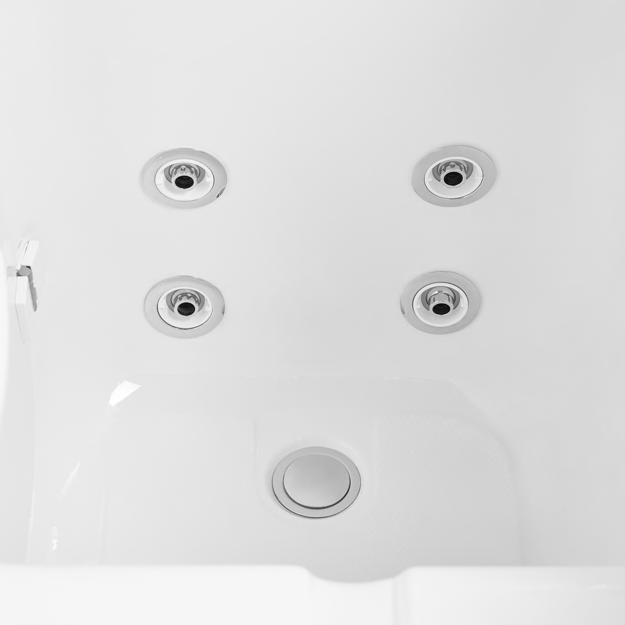 Footwell of an Ella walk-in tub showing four chrome foot jets and the floor drain on the white acrylic floor