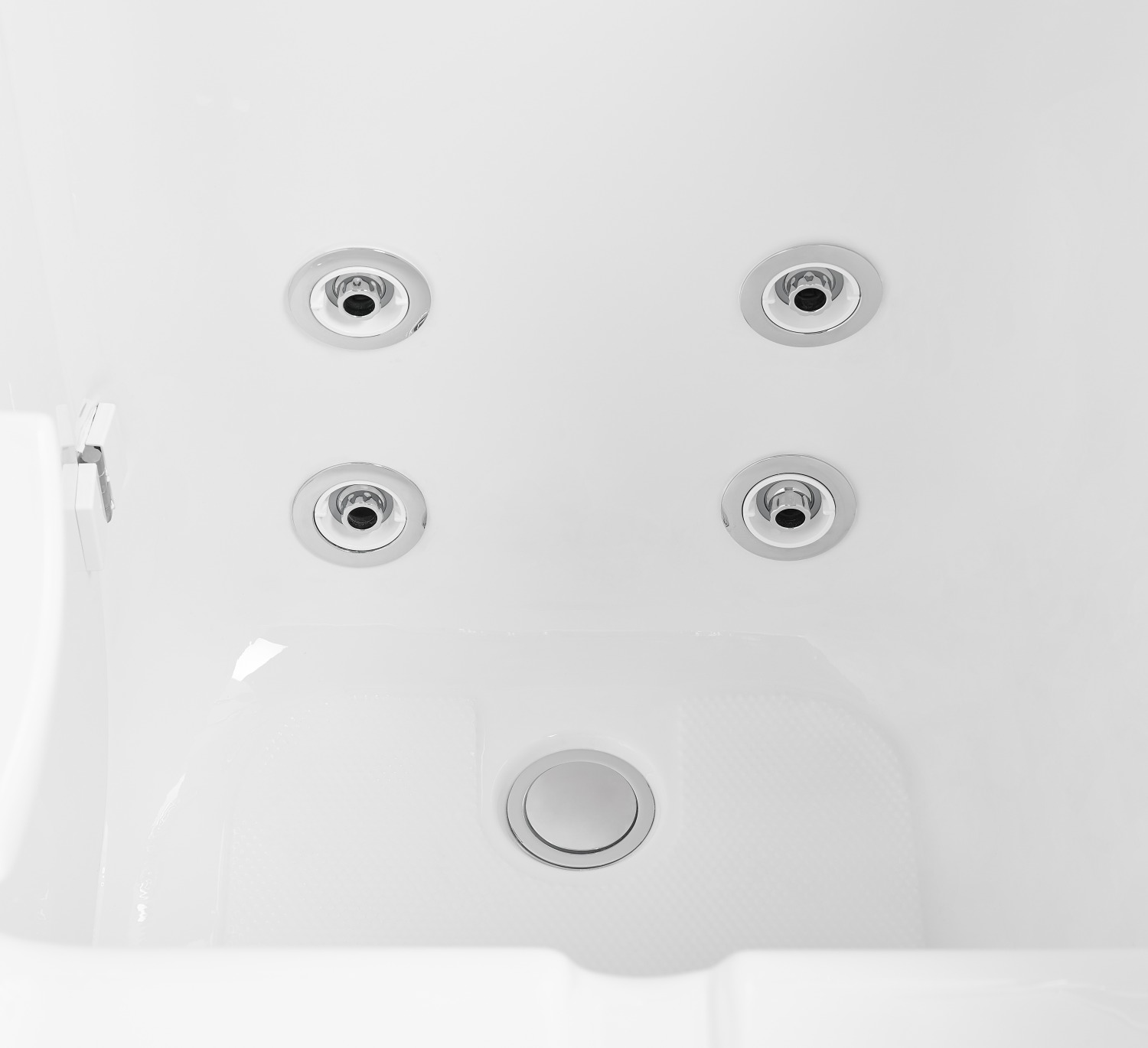 Close-up of the single 2 inch floor drain and chrome hydro jets on the floor of an Ella Standard walk-in tub