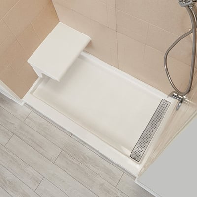 Overhead view of Ella cultured marble accessible shower base with built-in seat and stainless steel trench drain