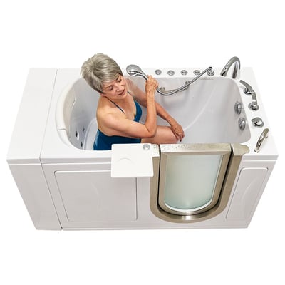 Senior woman using handheld showerhead while seated inside the Ella Elite walk-in tub with dual hydro jets and outward swing door
