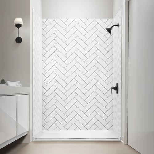 Walk in shower featuring white herringbone pattern acrylic wall panels and a low curb shower base