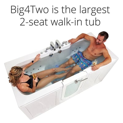 Couple relaxing with wine glasses in the Ella Big4Two 2-seat walk-in tub featuring hydro massage jets and outward swing door