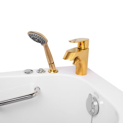Close-up of a gold fast-fill faucet and handheld showerhead mounted on an Ella walk-in tub deck with chrome grab bar