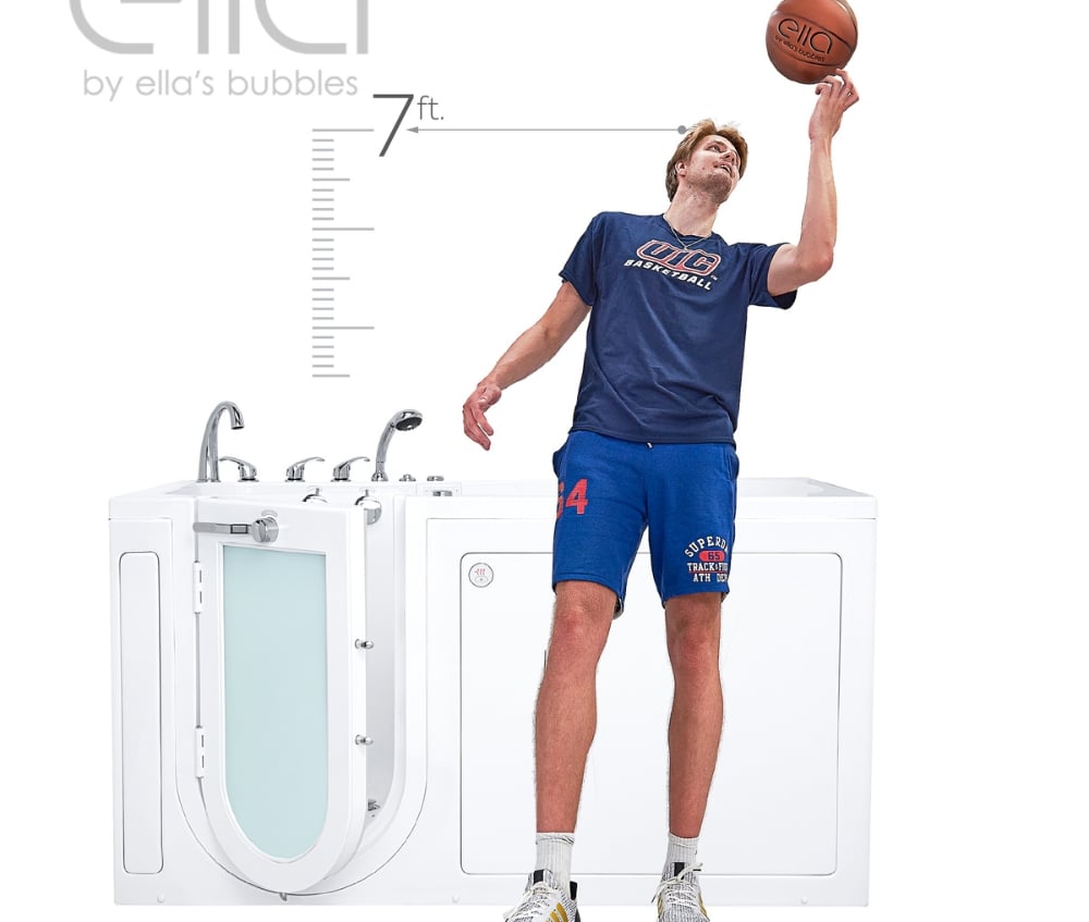 Tall man spinning a basketball standing next to an Ella walk-in tub with 7ft height scale graphic