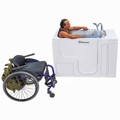 Person soaking in the Ella Transfer30 ADA accessible walk-in tub with an empty mobility aid parked nearby