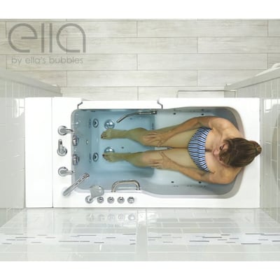 Overhead view of a woman soaking in the Ella Ultra acrylic walk-in tub showing hydro jets and chrome controls