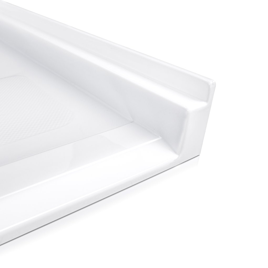 Close-up of Ella wheelchair accessible acrylic shower base corner showing low-step threshold and anti-slip textured floor