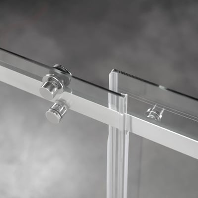 Close-up of chrome roller hardware and 8mm tempered glass panels on the Ella sliding shower door track system