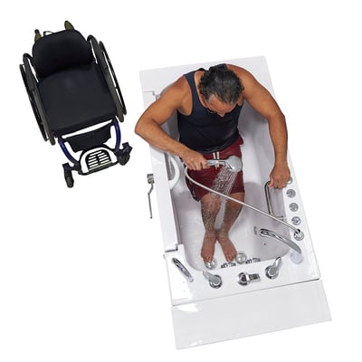 Man using a handheld showerhead inside the Ella Transfer30 wheelchair accessible walk-in tub with a wheelchair beside it