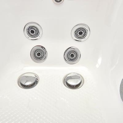 Close-up of chrome hydro massage jets and air bubble jets on the anti-slip floor of an Ella walk-in tub