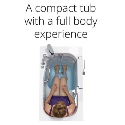Overhead view of a senior woman soaking in a compact Ella walk-in tub with full body water coverage and grab bars visible