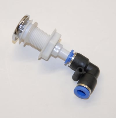 Close-up of a walk-in tub air jet fitting with chrome cap, white threaded body, and blue elbow connector