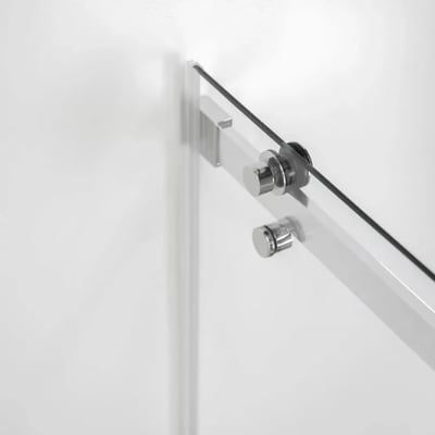 Close-up of chrome hardware and roller mechanism on an 8mm tempered glass sliding shower door panel
