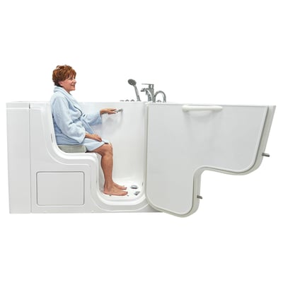 Senior woman in blue robe seated inside the Ella Transfer28 wheelchair accessible walk-in tub with outward swing door open
