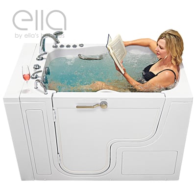 Woman reading a book while soaking in the Ella TransferXXL wheelchair accessible walk-in tub with hydro jets and a wine glass nearby