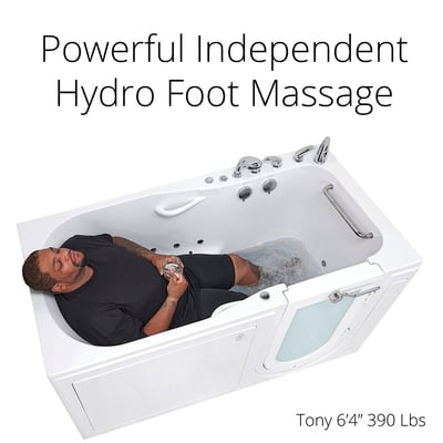 Large man relaxing with eyes closed holding a drink in an Ella walk-in tub enjoying hydro foot massage jets