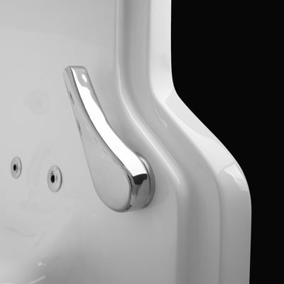 Polished chrome lever handle on the white acrylic door of a walk in bathtub, shot against a black background.
