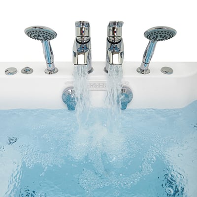 Close-up of dual chrome faucets and handheld showers filling the Ella Escape two-seat walk-in tub with bubbling water