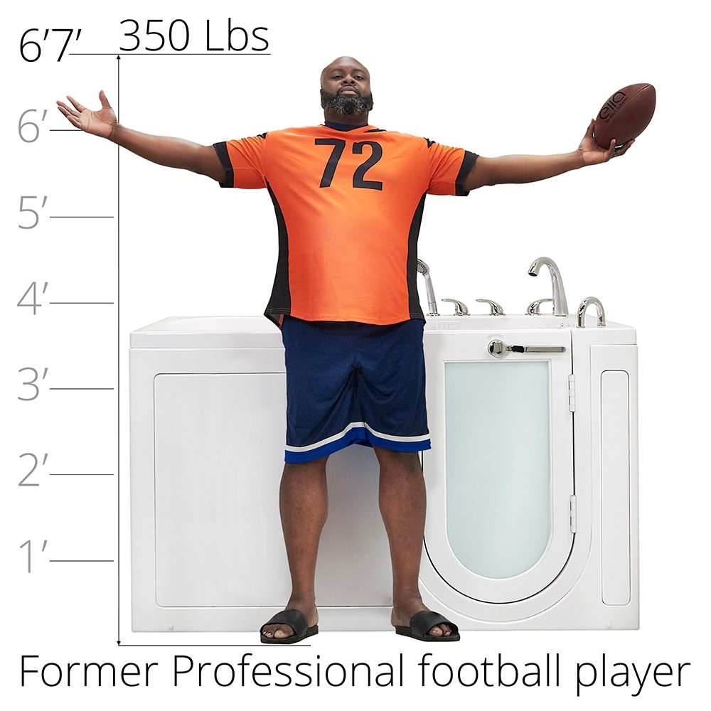 6 foot 7 inch, 350 pound former football player standing beside the Ella Big4One walk-in tub to show its size