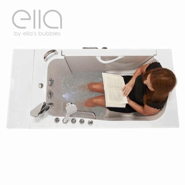 Overhead view of woman reading a book while soaking in an Ella wheelchair accessible transfer walk-in tub with hydro jets