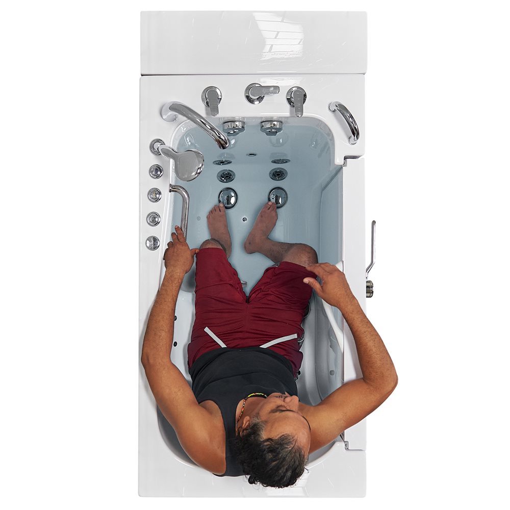 Overhead view of a person entering the Ella Transfer32 wheelchair accessible walk-in tub showing hydro jets and grab bars