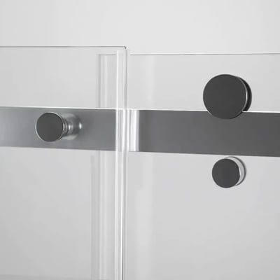 Close-up of chrome hardware and glass panel overlap on an Ella sliding shower door with 8mm tempered glass