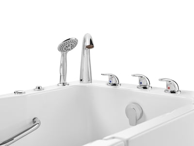Close-up of chrome faucet controls, handheld showerhead, and grab bar on the Ella Standard walk-in tub deck