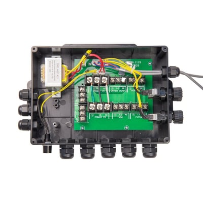 Open walk-in tub electrical junction box showing green circuit board with water pump, heat, and power terminals wired inside