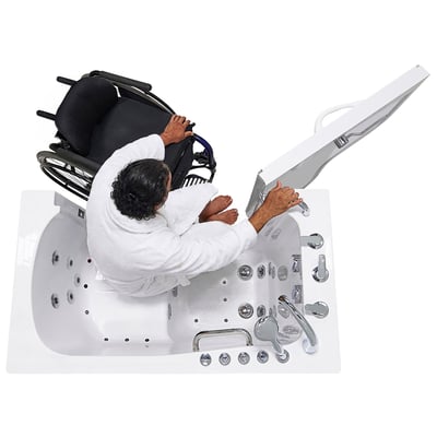 Man in a white robe transferring from a wheelchair into a wheelchair accessible Ella walk in tub