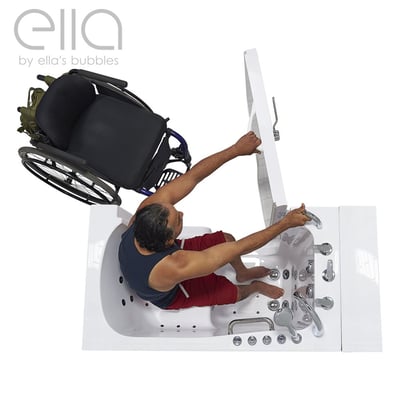 Overhead view of wheelchair user transferring into the Ella Transfer32 wheelchair accessible walk-in bathtub with open door