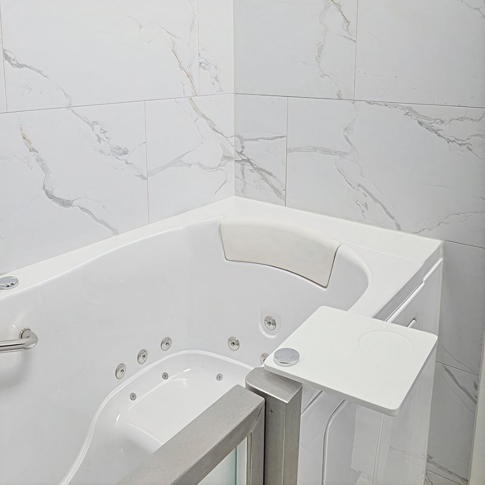 Ella walk-in tub alcove finished with Carrara marble-look grout-free tongue and groove wall tiles