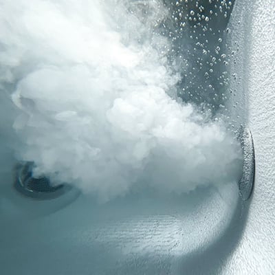 Close-up underwater view of powerful air bubble jets and swirling foam inside an Ella Royal walk-in tub