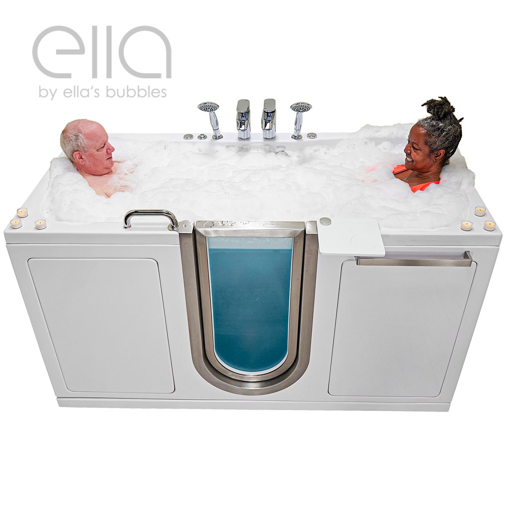 Two seniors relaxing together in an Ella's Bubbles two-seat walk-in tub filled with bubbles and dual faucets