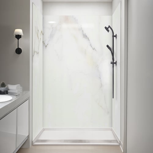 Ella accessible shower stall with marble Calacatta Chic acrylic wall panels, black handheld showerhead, and linear drain base